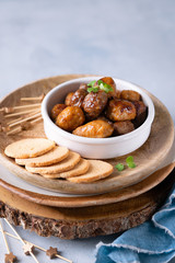 Mini chicken and lamb, veal kebabs starters snacks, skewers on light background with copy space, finger foods concept.
