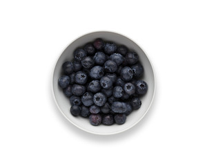 A white bowl full of delicious fresh Blueberries, isolated on white
