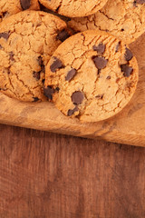 Chocolate chip cookies, gluten-free, on a dark rustic background with copyspace