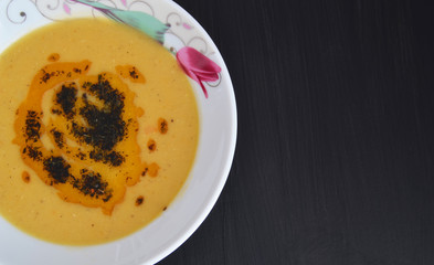 Lentil soup on wooden table