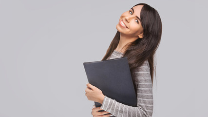 happy young woman with application binder