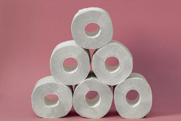 Roll of white toilet paper on colored background