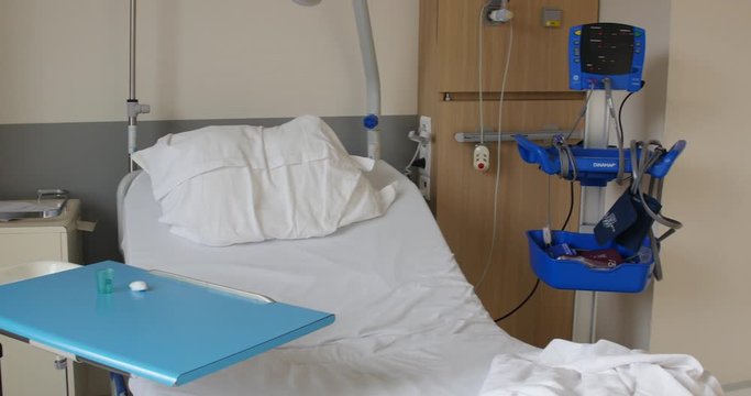 Empty hospital room with individual bed in intensive care cardiology unit, this old patient died. heavy treatments and solitude ends people life prematurely. Paris, France, 1.12.19
