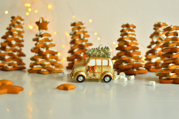 Christmas card with toy retro car,with bokeh New Year's lights. . Cozy christmas with gingerbread cookies, cinnamon, cardamom