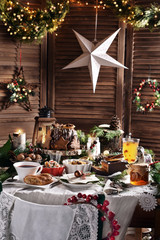 traditional Christmas Eve dishes and pastries on festive table