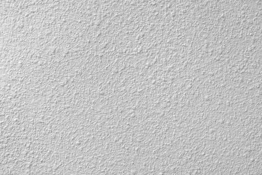 white colored low contrast Concrete textured background with roughness and irregularities to your design or product.