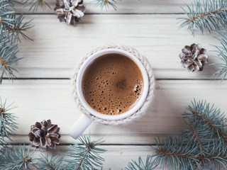 Obraz na płótnie Canvas Winter hot aromatic coffee on a white wooden table