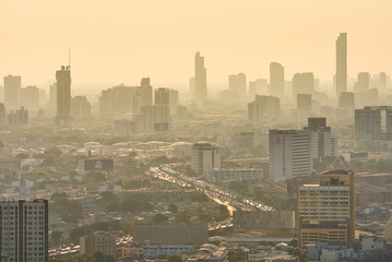 Bangkok / Thailand - 8 March 2019: Bird's eye view to show the beautiful sky and heavy traffic above the city view of Bangkok that is full of harmful PM 2.5 dust that is harmful to the body.