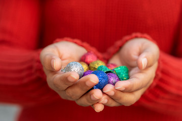 Person Holding Christmas Balls