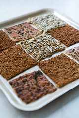 Turkish Homemade Snacks Biscuit with Sunflower Seeds, Sesame and Dill /Crispy Yaprak Galeta with Traditional Tea on Tray.