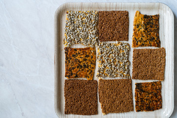 Turkish Homemade Snacks Biscuit with Sunflower Seeds, Sesame and Dill /Crispy Yaprak Galeta with Traditional Tea on Tray.