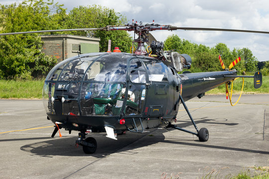 BEAUVECHAIN, BELGIUM - MAY 20, 2015: Belgian Navy Aerospatiale Alouette III rescue helicopter sitting idle on Beavechain airbase.