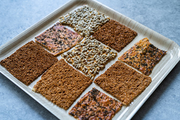 Turkish Homemade Snacks Biscuit with Sunflower Seeds, Sesame and Dill /Crispy Yaprak Galeta with Traditional Tea on Tray.