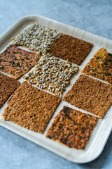 Turkish Homemade Snacks Biscuit with Sunflower Seeds, Sesame and Dill /Crispy Yaprak Galeta with Traditional Tea on Tray.