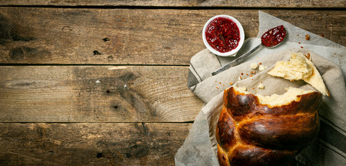 Traditional jewish bread challah on wood background, top view
