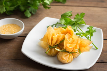 Thai Money Bag (Thai Traditional Spring Rolls) with sweet plum sauce