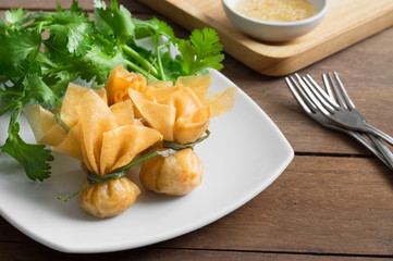 Thai Money Bag (Thai Traditional Spring Rolls) with sweet plum sauce