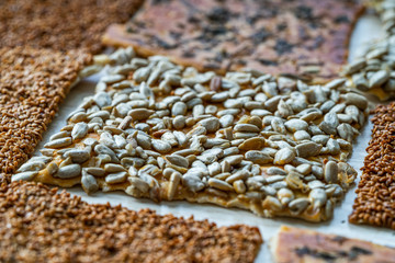 Turkish Homemade Snacks Biscuit with Sunflower Seeds, Sesame and Dill /Crispy Yaprak Galeta with Traditional Tea on Tray.