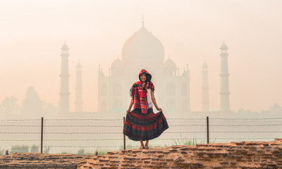 A woman visit Taj Mahal at early morning