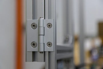 Aluminium door panel with an Aluminium hinge.