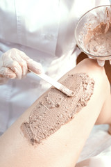 Scrub application on skin of body. Concept of medecine, aesthetics and cosmetology.