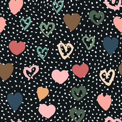 Doodle hearts seamless pattern on polka dot background.