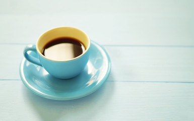 cup of coffee on wooden table