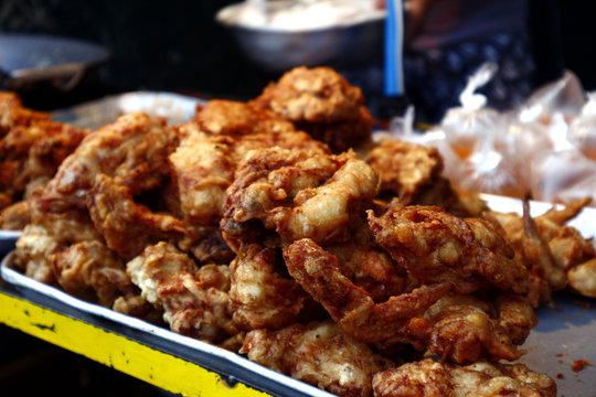 Freshly fried chicken at a food cart