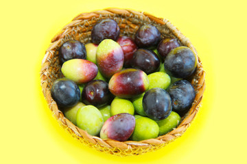 natural fresh black and burgundy olives in a decorative plate