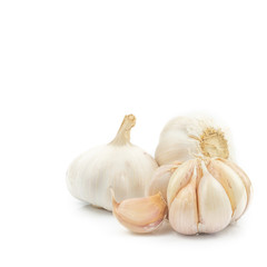Fresh Organic Garlic Bulbs and Garlic Cloves (Allium sativum) isolated on white background. concept Herbal and Vegetable extracts are medications for Reduce heart disease risk and relieve colds.