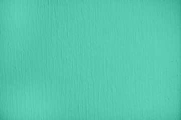 Trendy mint colored low contrast Concrete textured background with roughness and irregularities to your design or product. Color trend concept.