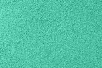 Naklejka premium Trendy mint colored low contrast Concrete textured background with roughness and irregularities to your design or product. Color trend concept.