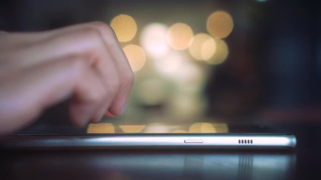 4k video People hand using smartphone with blur cafe shop background. Business, financial, trade stock maket and social network concept.