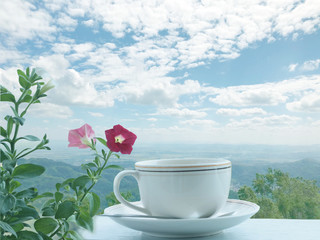 Cup of coffee   on moutain  bac kgriund.