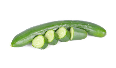 uncooked whole and sliced fresh Japanese cucumbers on white background