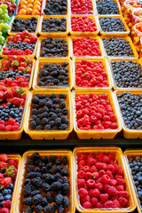 Fresh berries at display on the farmers market stall