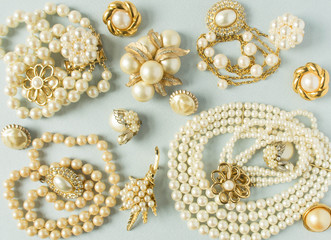 Pearls background. Woman's Jewelry. Vintage jewelry background. Beautiful gold tone and pearls...