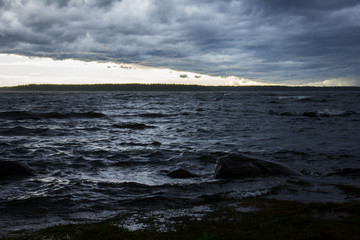 storm on the seashore during summer sunset