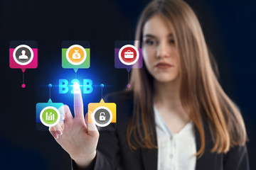 Business, Technology, Internet and network concept. Young businessman working on a virtual screen of the future and sees the inscription: B2B