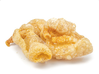 Fried pork rinds, pork snack, pork scratching and pork crackling isolated on white background