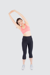 Fototapeta premium Beautiful young asian woman in sport standing stretch muscle arm workout with healthy isolated on white background, girl wear shape fit warm up and exercise and yoga for health, wellness concept.