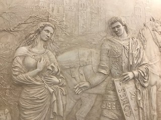Fototapeta na wymiar Bas-relief with man and woman on the wall