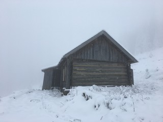 Winter mountain landscape in foggy Carpathians