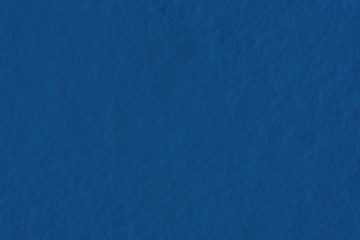 Texture of fresh snow colored in classic blue color of the year 2020. Main pantone color trend,...