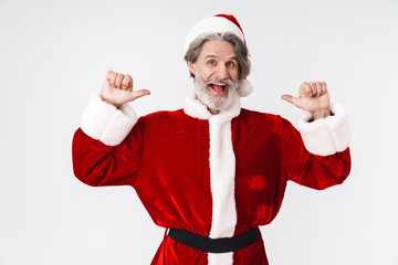 Fototapeta na wymiar Image of Santa Claus man in red costume pointing fingers at himself