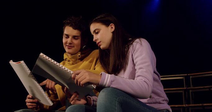 Teenagers rehearsing in a theatre