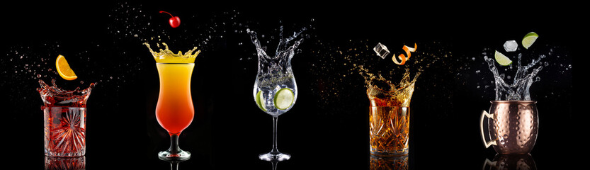 fruit falling into a collection of splashing cocktails isolated on black background