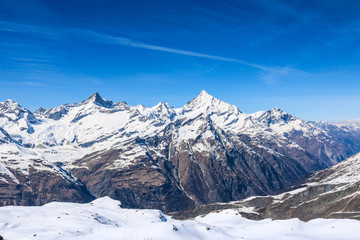 Panoramic landscape of snow mountain range in Switzerland with sunny day