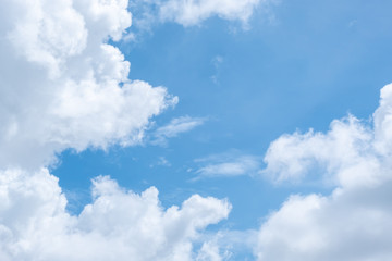 Obraz na płótnie Canvas Soft blue sky with clouds and sun flare.