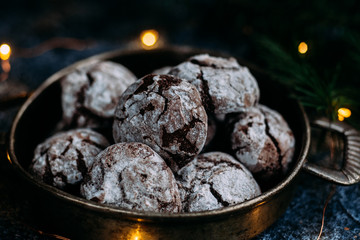 Chocolate Crinkle Cookies on a blue table. New Year, Christmas